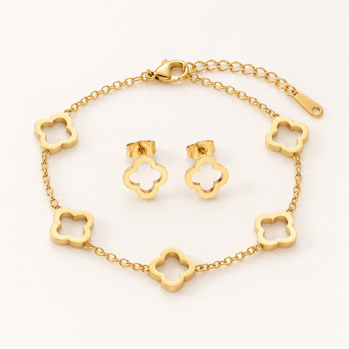 Gold-tone stainless steel clover jewellery set with bracelet and matching stud earrings