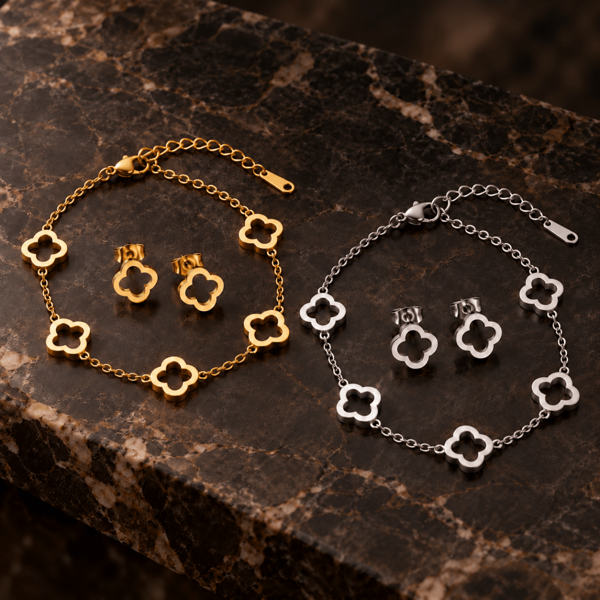 Clover bracelets and matching stud earrings in gold and silver tones on dark stone